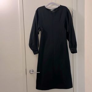 Modern black dress. Fitted, slightly puffed sleeve. SizeXS. Excellent condition